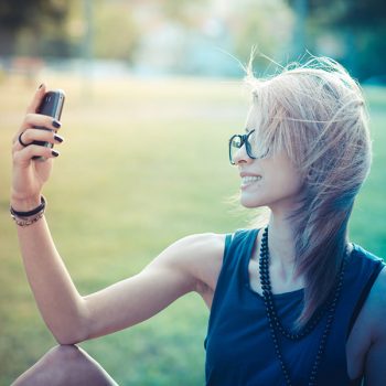 young beautiful model woman selfie in the city